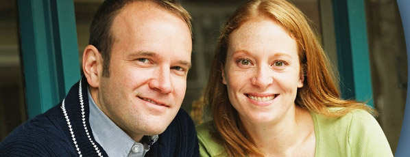 man and woman smiling