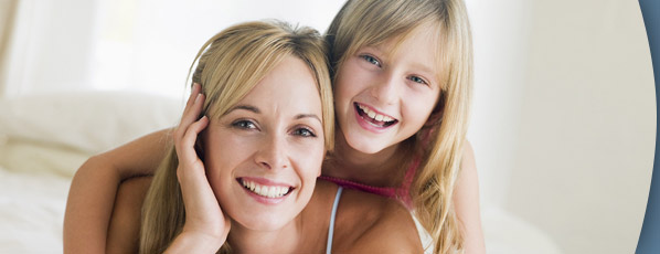 woman and young girl smiling